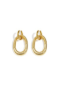 Statement earrings with detailed oval pendant